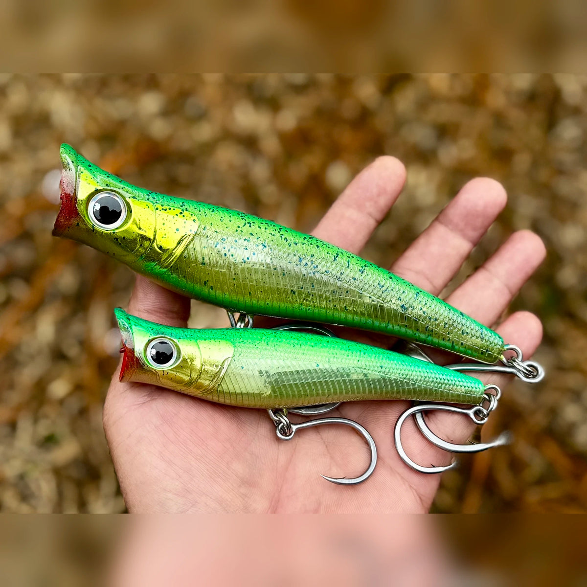 Mikros-Pop 130 and 170 in Mahi Mahi held in hand for size