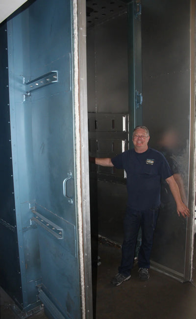 Randy Penny of United Composites standing in the UC blank-curing oven