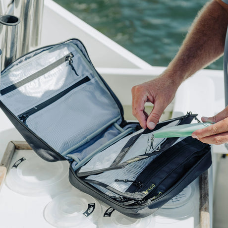 AFTCO Lure Binder open, showing clear sleeve pages and zip pockets