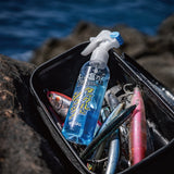 Varivas Salt Neutralizing Spray standing in a tackle case full of lures at the coast